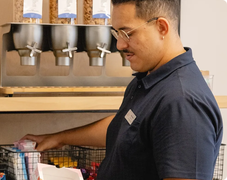Office manager restocking the pantry shelves